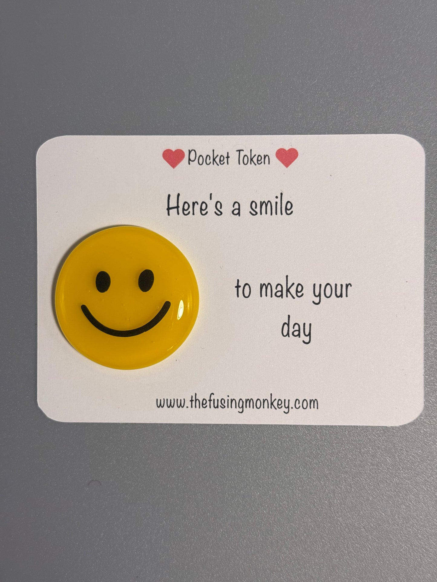 Here's a smile to make your day glass token